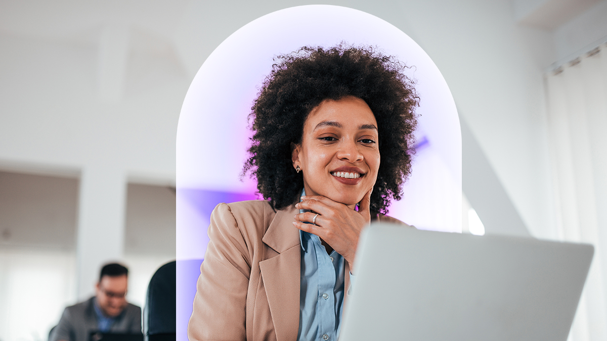 Corporate woman smiling on a laptop