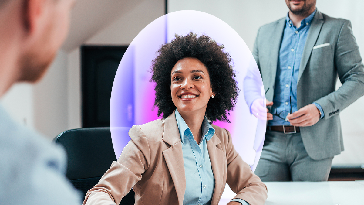 Corporate woman smiling at corporate man in an office