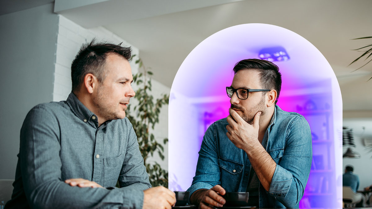 Two corporate men sitting and discussing