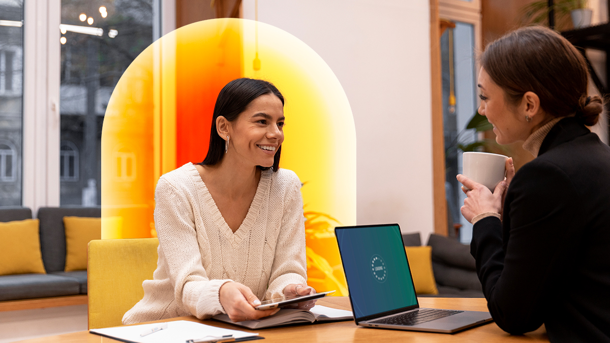 Seated corporate women discussing